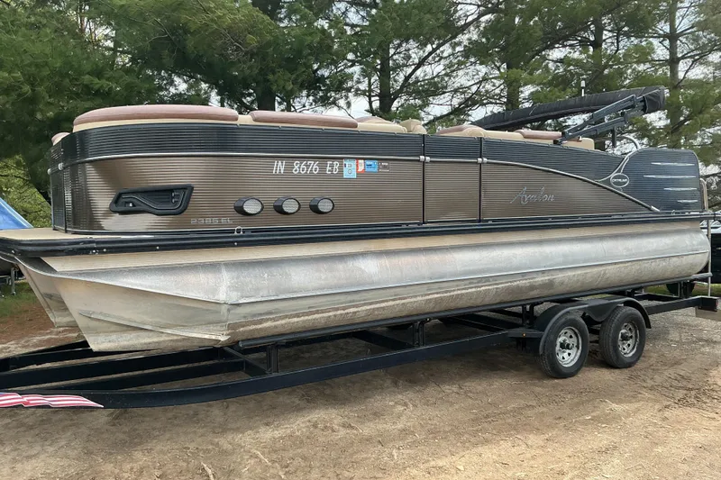 The Image of 2019 Avalon Catalina Platinum Rear J Lounge pontoon boat on trailer. - 1