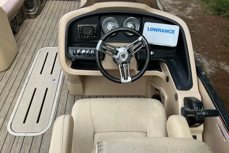 Slide: The Image of Steering console of 2019 Avalon Catalina Platinum Rear J Lounge boat with Lowrance display. - 12