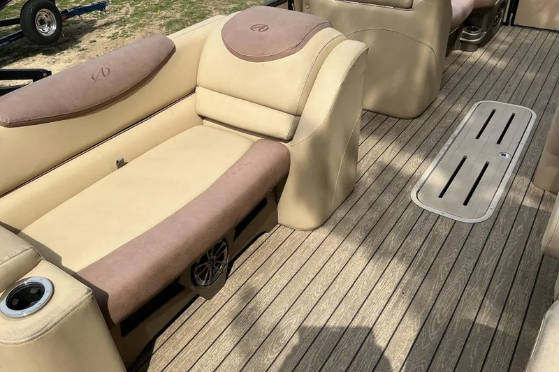Slide: The Image of 2019 Avalon Catalina Platinum Rear J Lounge boat interior with beige seating and wood-style flooring. - 13