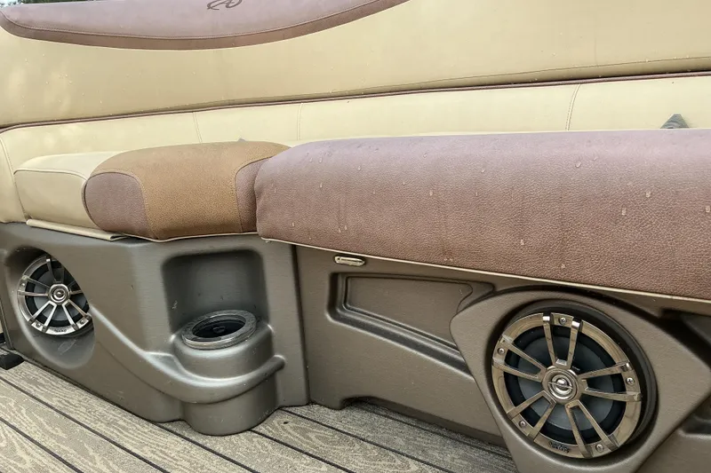 Slide: The Image of 2019 Avalon Catalina Platinum boat seating with speakers and cup holder. - 14