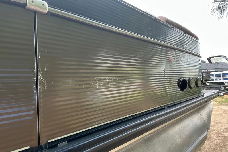 Slide: The Image of 2019 Avalon Catalina Platinum Rear J Lounge pontoon boat side view. - 4