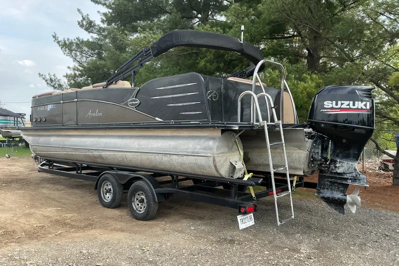 Slide: The Image of 2019 Avalon Catalina Platinum pontoon boat on trailer with Suzuki outboard motor. - 5
