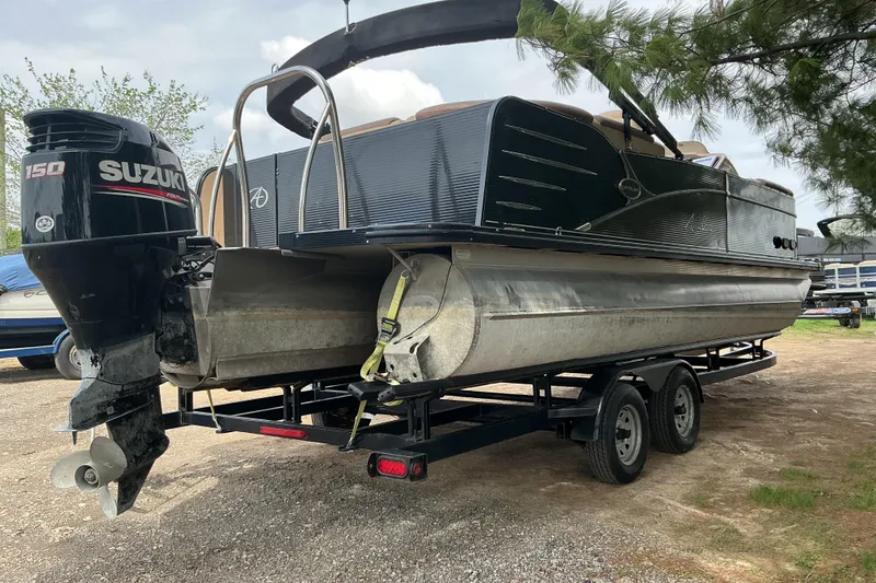 Slide: The Image of 2019 Avalon Catalina Platinum Rear J Lounge boat on trailer with Suzuki engine. - 6