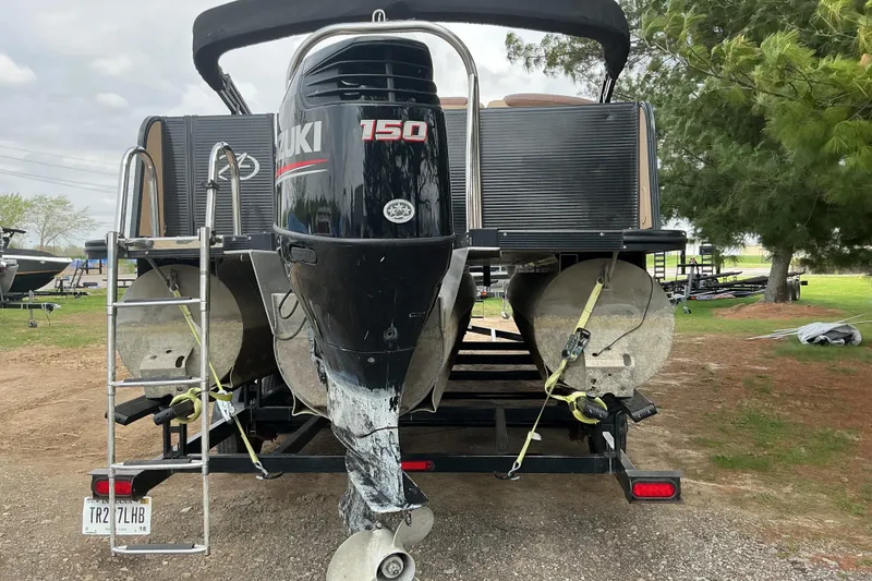 Slide: The Image of 2019 Avalon Catalina Platinum Rear J Lounge boat with Suzuki 150 engine on trailer. - 7