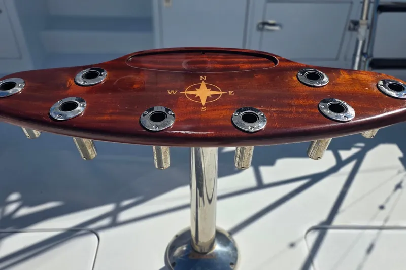 Slide: The Image of Wooden fishing rod holder on 1989 Hatteras 52 Convertible yacht deck. - 33