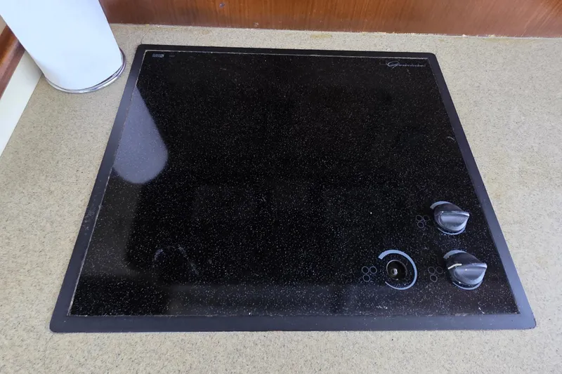Slide: The Image of Ceramic cooktop with control knobs on a 1989 Hatteras 52 Convertible yacht. - 11