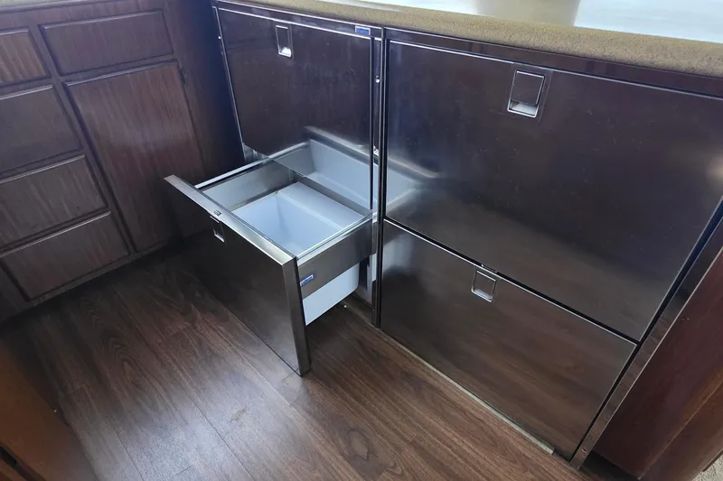 Slide: The Image of Stainless steel drawer in 1989 Hatteras 52 Convertible yacht kitchen interior. - 12