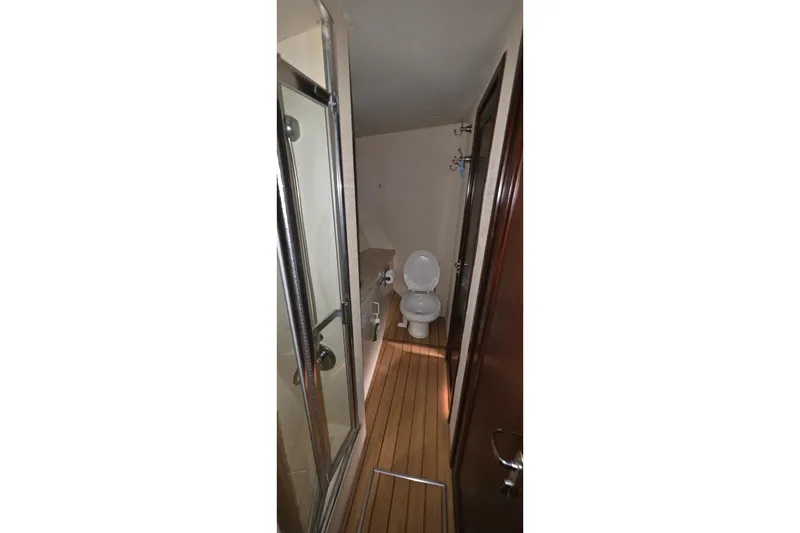Slide: The Image of Bathroom interior of 1989 Hatteras 52 Convertible yacht with shower and toilet. - 19