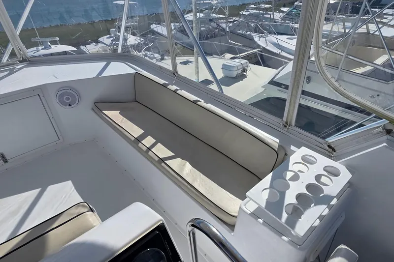 Slide: The Image of Interior view of 1989 Hatteras 52 Convertible yacht with seating and cup holders. - 41