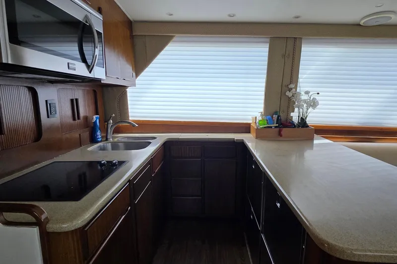 Slide: The Image of Interior kitchen of 1989 Hatteras 52 Convertible yacht with modern appliances. - 9
