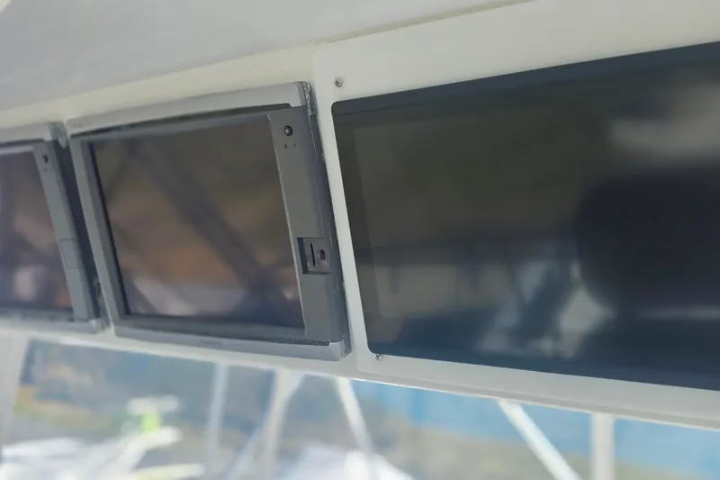 Slide: The Image of Control panel screens on a 1989 Hatteras 52 Convertible yacht. - 39