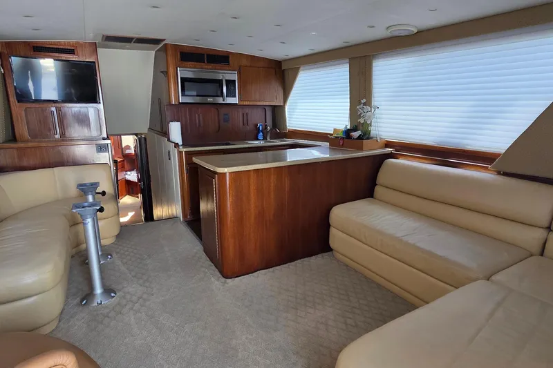 Slide: The Image of Interior of 1989 Hatteras 52 Convertible yacht with kitchen and seating area. - 7