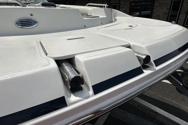 Slide: The Image of 2014 Hurricane SunDeck 187 IO boat deck with sleek design and storage compartments. - 14