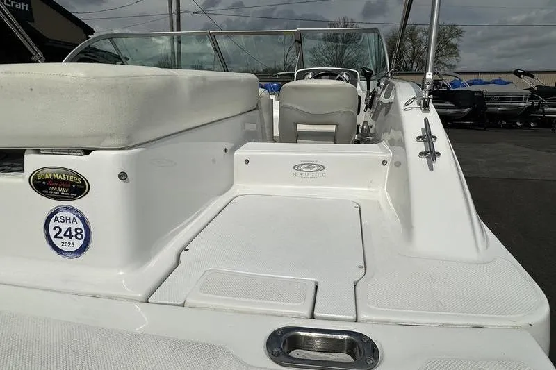 Slide: The Image of 2014 Hurricane SunDeck 187 IO boat interior with seating and dashboard view. - 17