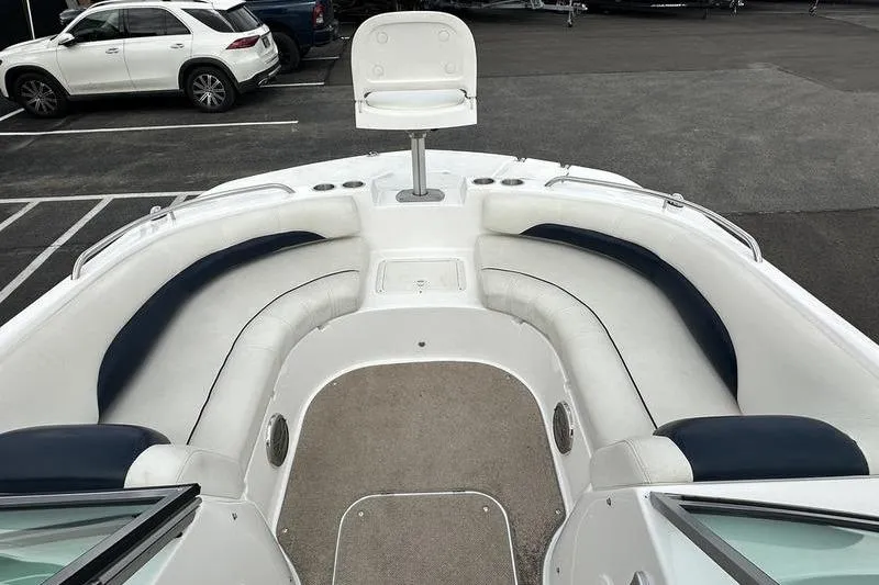 Slide: The Image of 2014 Hurricane SunDeck 187 IO boat interior with white and navy seating. - 19
