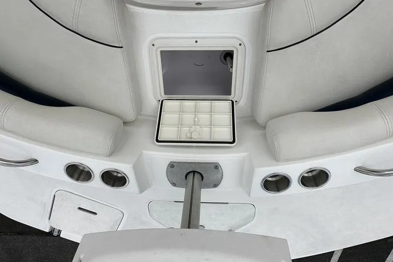 Slide: The Image of 2014 Hurricane SunDeck 187 IO boat interior with seating and storage compartment. - 20