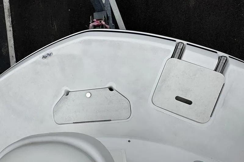 Slide: The Image of 2014 Hurricane SunDeck 187 IO boat deck with storage compartments and seating area. - 22