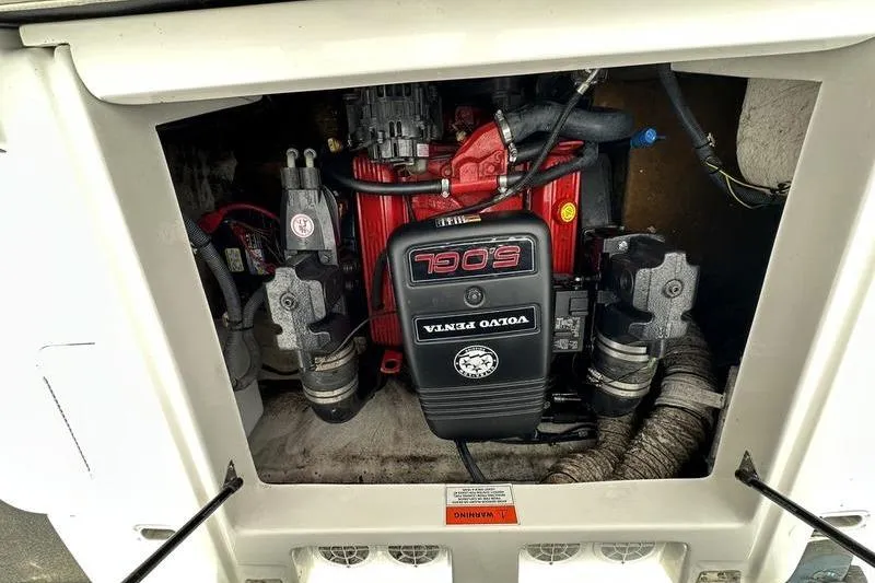 Slide: The Image of Volvo Penta engine in 2014 Hurricane SunDeck 187 IO boat, showcasing internal components. - 26