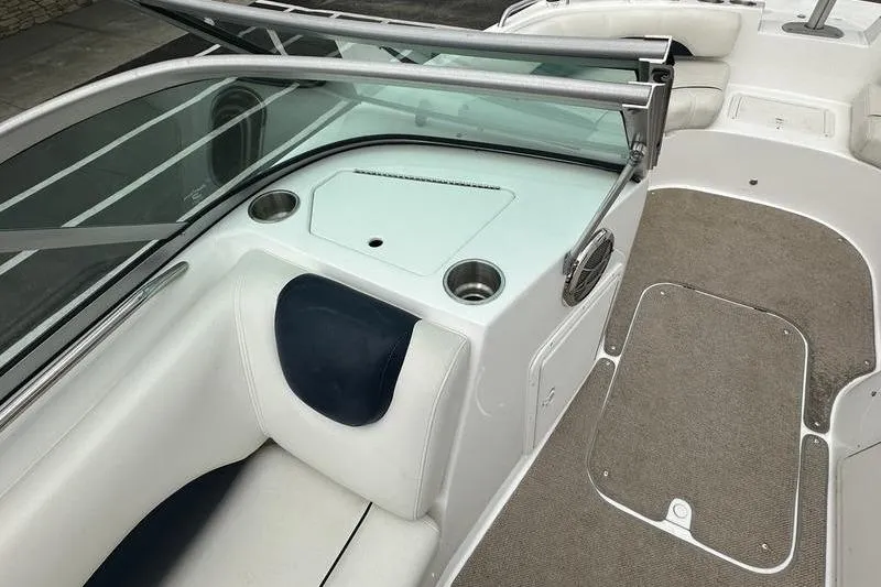 Slide: The Image of 2014 Hurricane SunDeck 187 IO boat interior with seating and cup holders. - 30