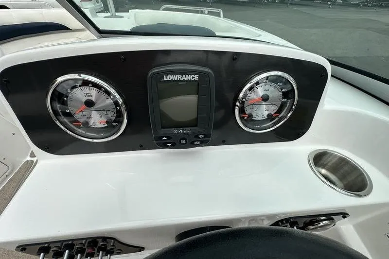 Slide: The Image of Dashboard of 2014 Hurricane SunDeck 187 IO boat with gauges and Lowrance display. - 36