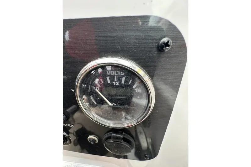 Slide: The Image of Voltmeter gauge on 2014 Hurricane SunDeck 187 IO boat dashboard. - 38