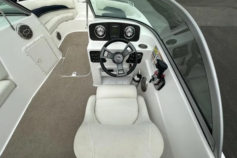 Slide: The Image of 2014 Hurricane SunDeck 187 IO boat interior with steering wheel and seating. - 41