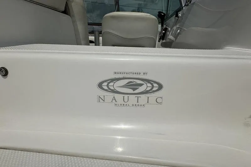 Slide: The Image of 2014 Hurricane SunDeck 187 IO boat interior with Nautic Global Group logo. - 6