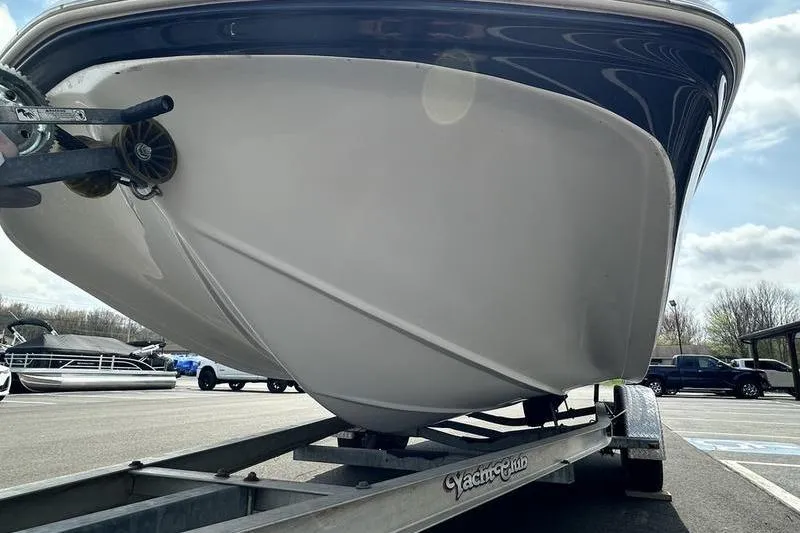 Slide: The Image of 2014 Hurricane SunDeck 187 IO boat on trailer in parking lot. - 7