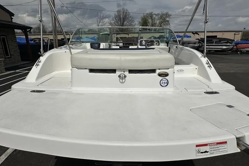 Slide: The Image of 2014 Hurricane SunDeck 187 IO boat, rear view, parked outdoors. - 8
