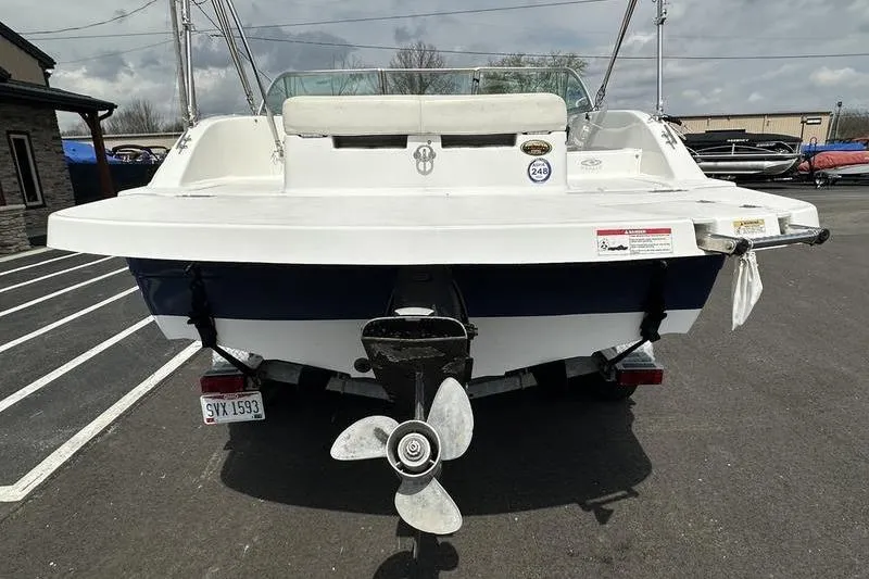 Slide: The Image of 2014 Hurricane SunDeck 187 IO boat rear view with propeller and seating. - 9