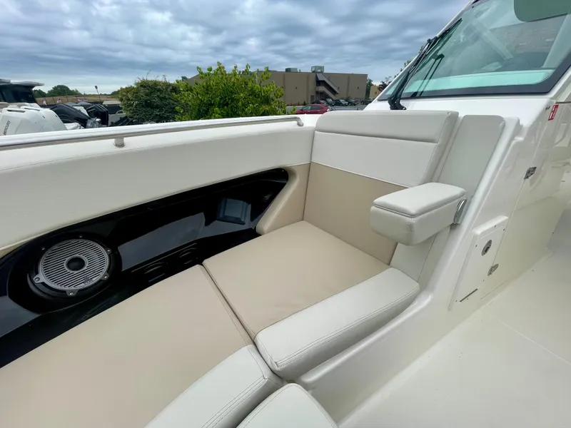 Slide: The Image of The 2027 Boston Whaler 280 Vantage features a comfortable bench seat with a speaker and armrest. - 31