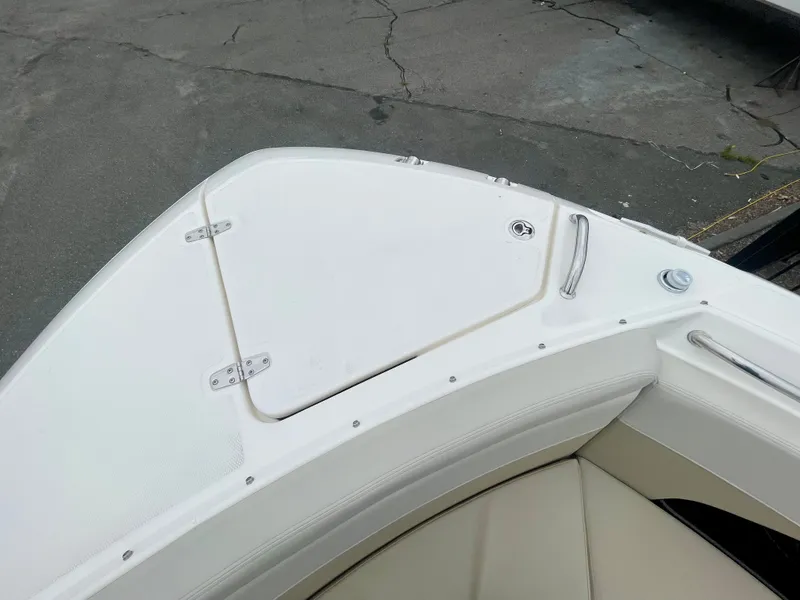 Slide: The Image of The bow of a 2027 Boston Whaler 280 Vantage with a white deck and seating area. - 33