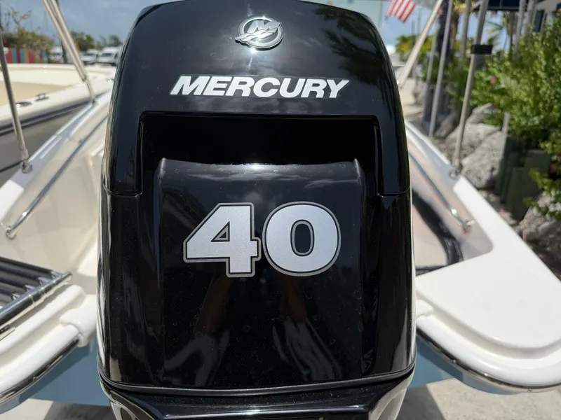 Slide: The Image of A Mercury 40 HP outboard motor on a Boston Whaler 130 Super Sport boat. - 4