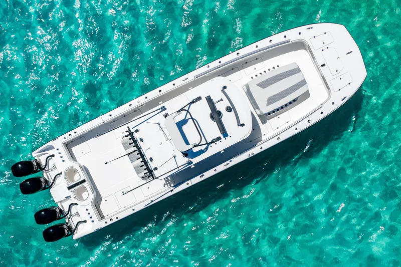 Slide: The Image of Aerial view of 2019 Invincible 40 Catamaran on clear turquoise water. - 11