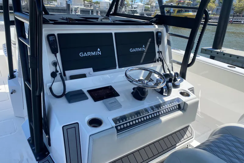 The Image of Cockpit of 2019 Invincible 40 Catamaran with Garmin navigation system and steering wheel. - 6