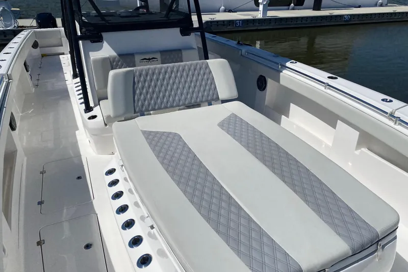 Slide: The Image of 2019 Invincible 40 Catamaran cruising in clear turquoise waters. - 8