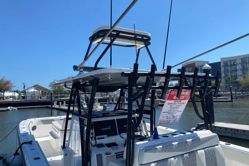 Slide: The Image of Aerial view of 2019 Invincible 40 Catamaran on clear turquoise water. - 9