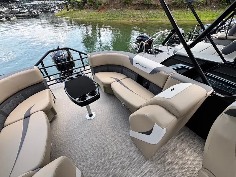 Slide: The Image of The image shows the interior of a 2026 Starcraft SLS 3 R boat with beige seating and a table. - 7