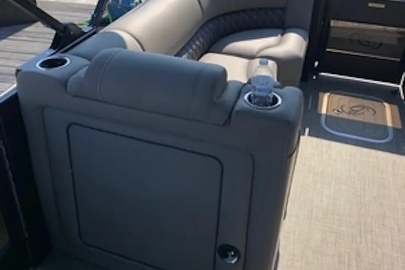 Slide: The Image of Luxurious seating on a 2021 Barletta L25UE pontoon boat with cup holders. - 10