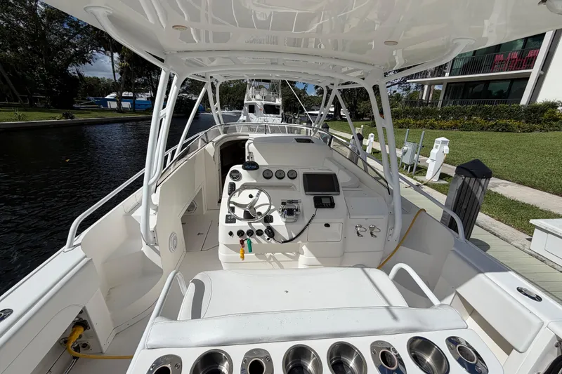 Slide: The Image of 2008 Intrepid 350 Center Console boat interior with steering wheel and control panel. - 14