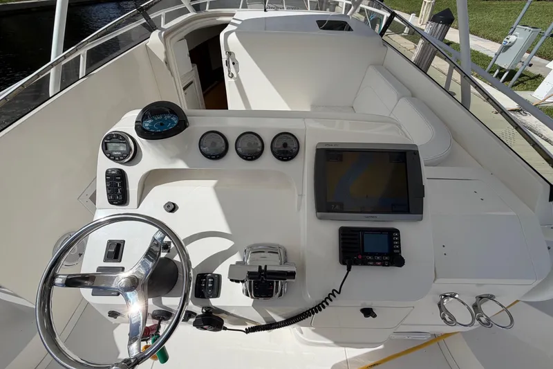 Slide: The Image of 2008 Intrepid 350 Center Console boat dashboard with steering wheel and navigation instruments. - 18