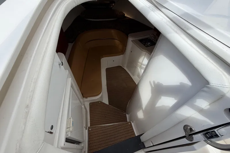 Slide: The Image of 2008 Intrepid 350 Center Console cabin interior with seating and sink. - 29