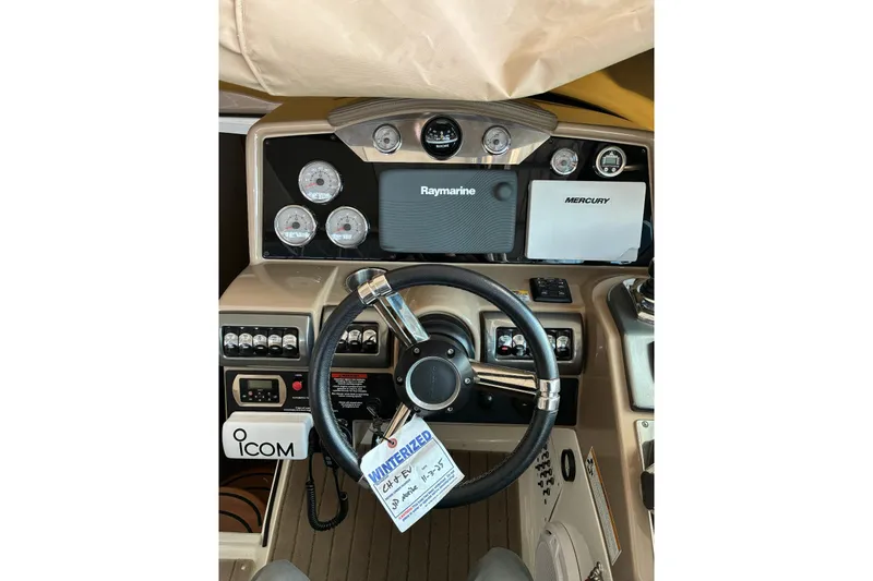 Slide: The Image of 2014 Formula 350 Crossover Bowrider dashboard with steering wheel and navigation instruments. - 10