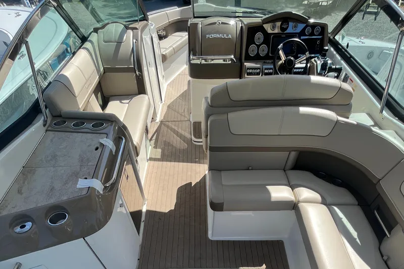 Slide: The Image of 2014 Formula 350 Crossover Bowrider interior with luxurious seating and modern dashboard. - 11