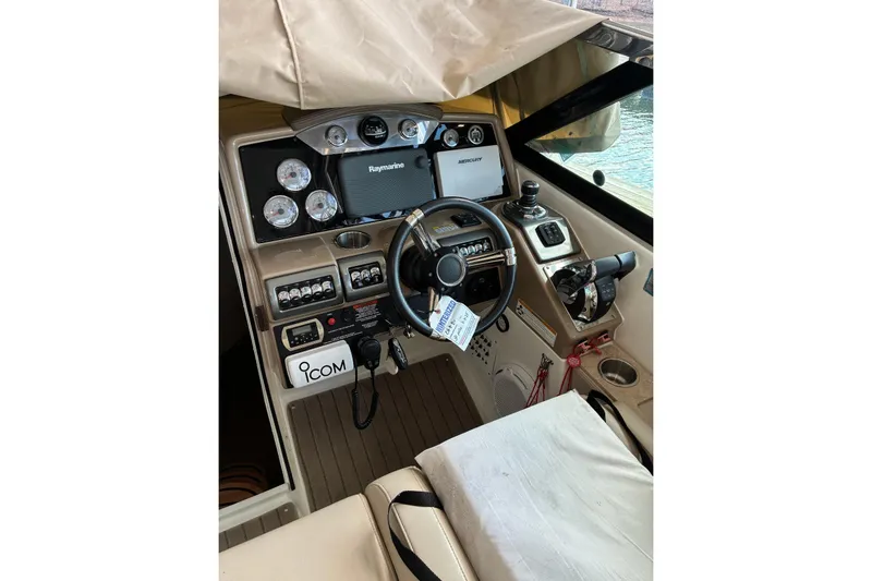 Slide: The Image of 2014 Formula 350 Crossover Bowrider cockpit with steering wheel and navigation controls. - 20