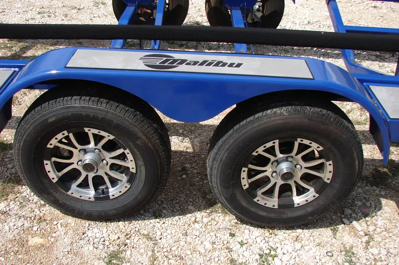 Slide: The Image of Blue trailer with dual wheels for 2017 Malibu Wakesetter 24 MXZ boat. - 15