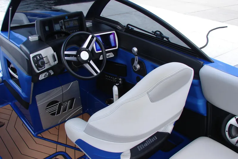 Slide: The Image of 2017 Malibu Wakesetter 24 MXZ boat interior with steering wheel and control panel. - 27
