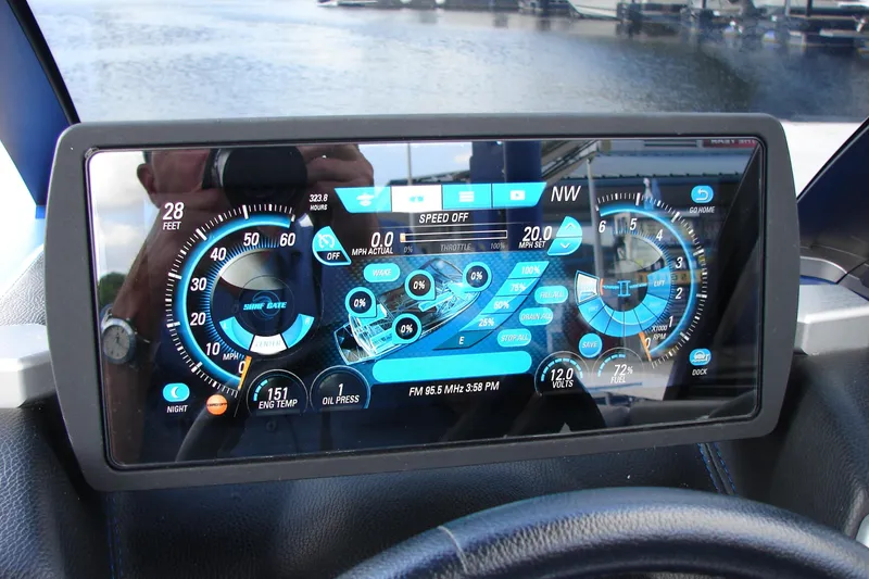 Slide: The Image of Dashboard of 2017 Malibu Wakesetter 24 MXZ boat with digital display and controls. - 29