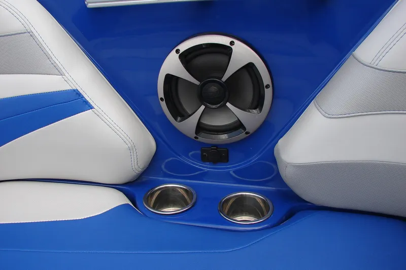 Slide: The Image of Blue and white interior of 2017 Malibu Wakesetter 24 MXZ with speaker and cup holders. - 35