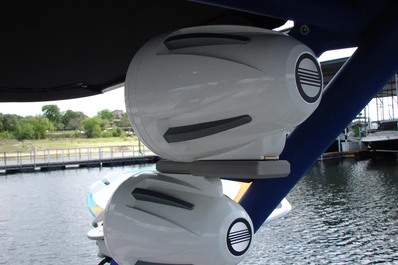 Slide: The Image of Speakers on a 2017 Malibu Wakesetter 24 MXZ boat, docked by the water. - 41